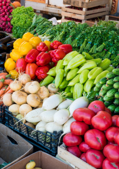 Fresh, colorful produce displayed at an outdoor farmers market near St. Pete Beach.